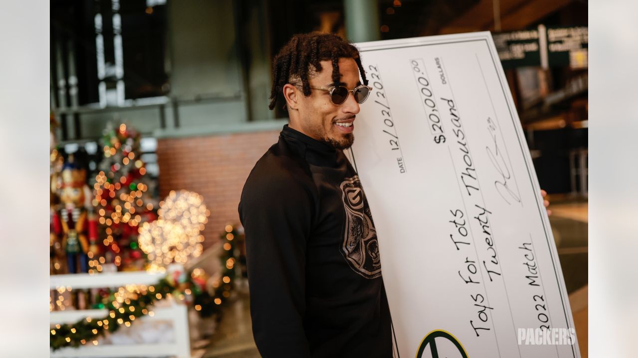 Photos: Packers, Jaire Alexander award donations to Toys for Tots at  Lambeau Field