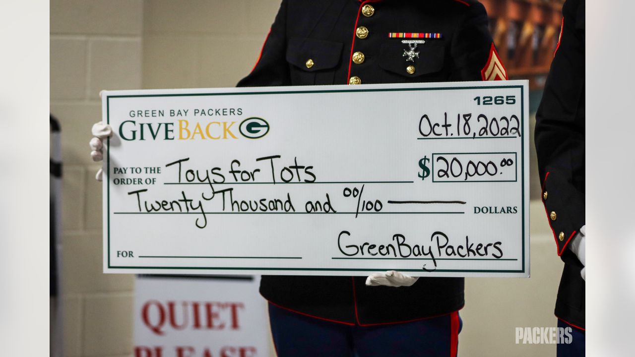 Photos: Packers, Jaire Alexander award donations to Toys for Tots at  Lambeau Field