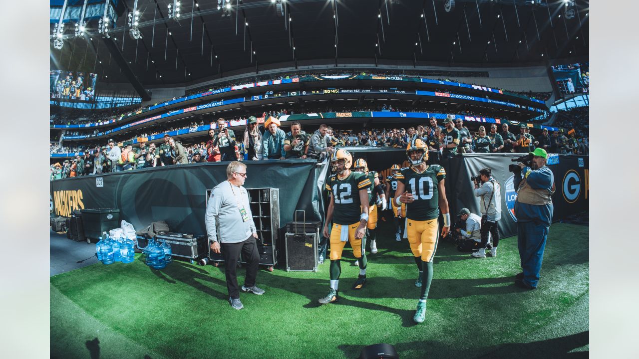 Green Bay Packers players form a huddle as they warm-up before an NFL game  between the New York Giants and the Green Bay Packers at the Tottenham  Hotspur stadium in London, Sunday