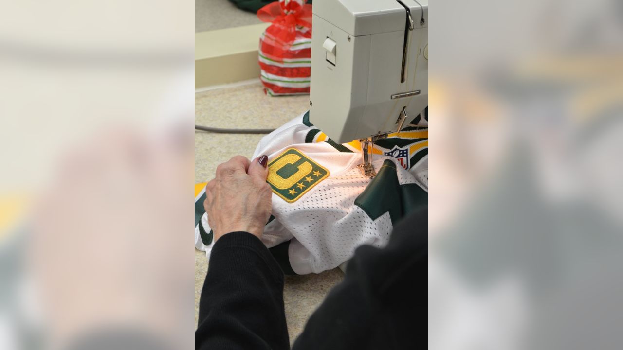 Captains patches are sewn to Packers jerseys