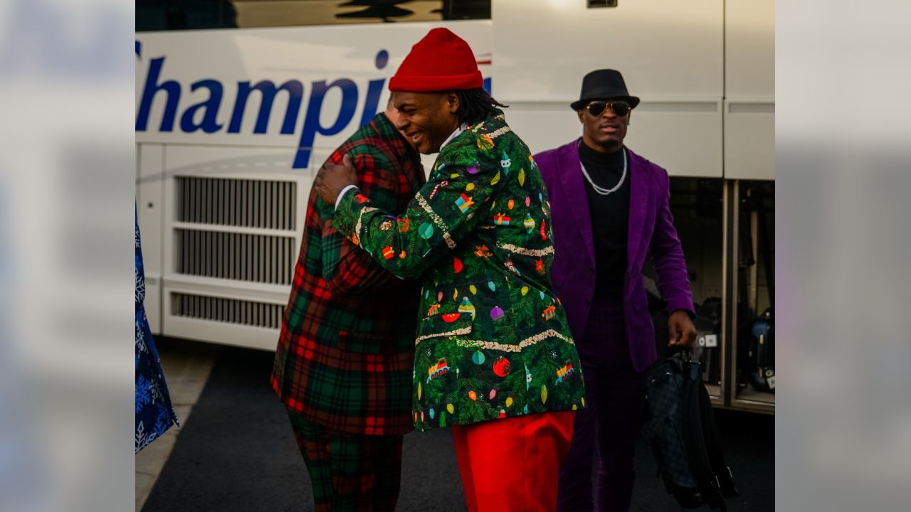 Packers wear Christmas suits to North Carolina