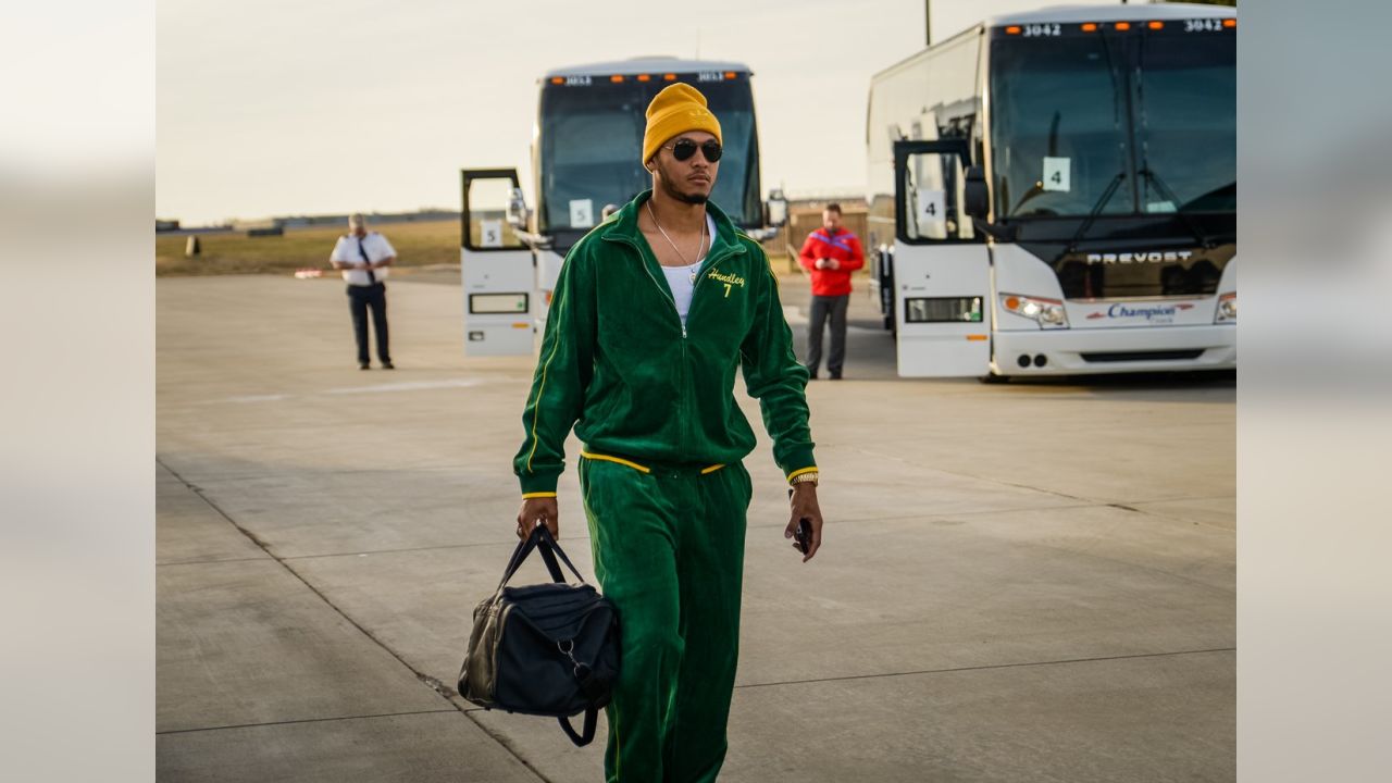 Packers wear Christmas suits to North Carolina