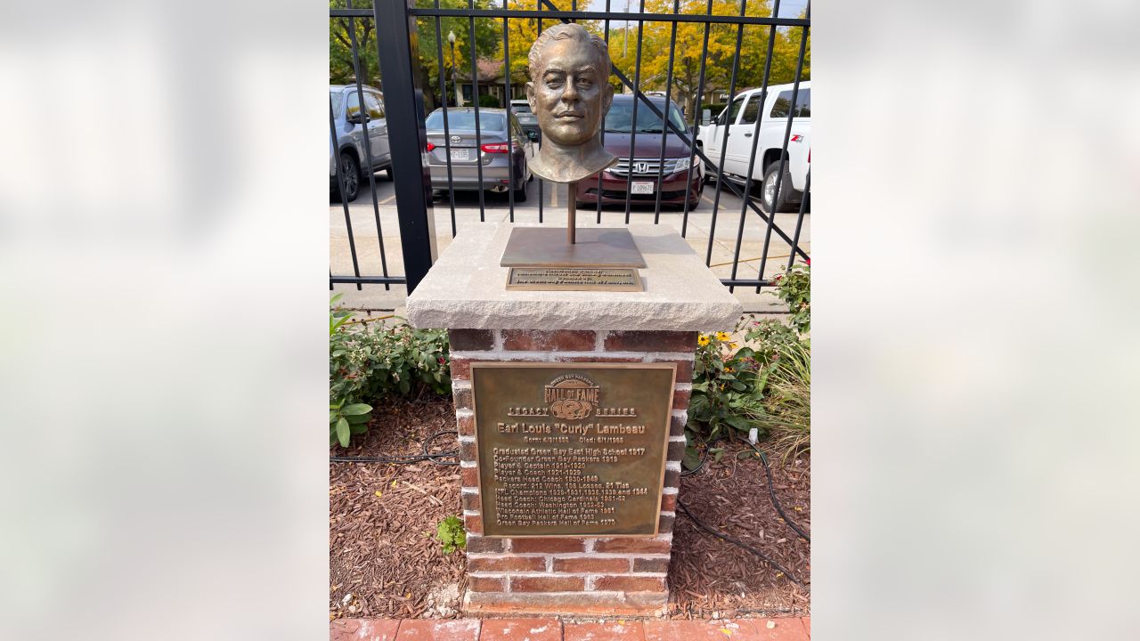 Statue of Curly Lambeau founder of professional football team