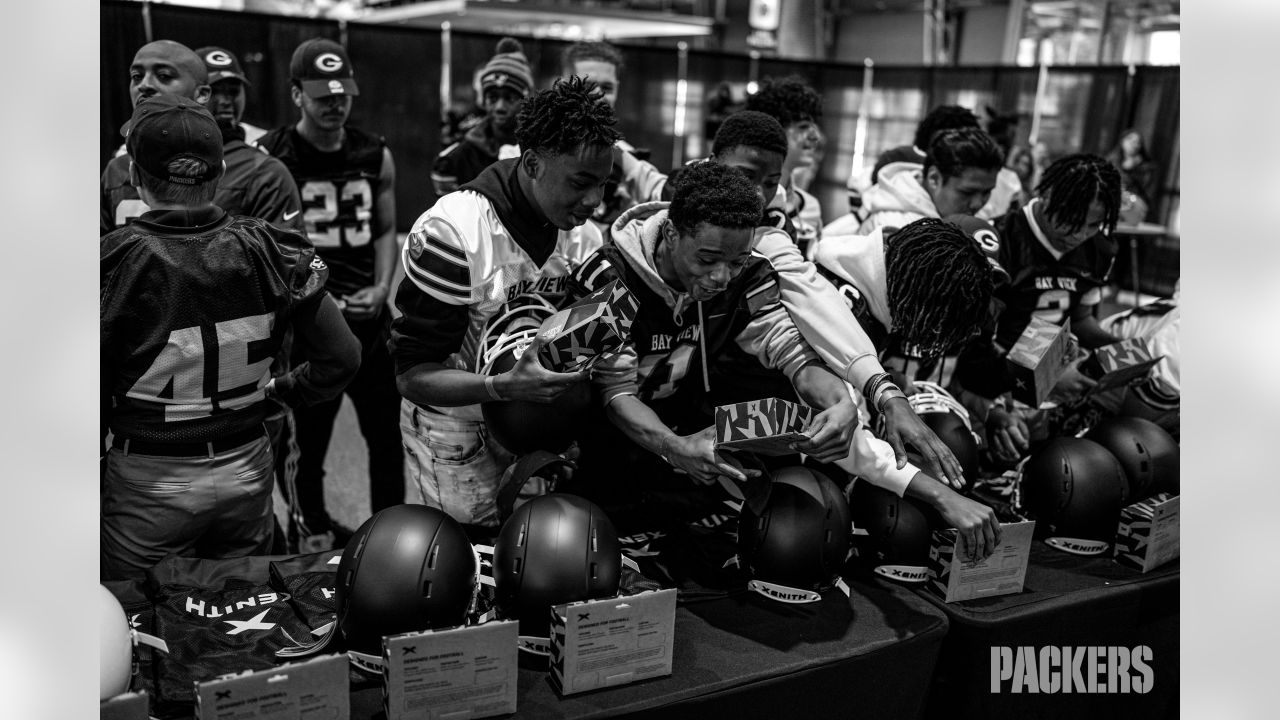 Photos: Packers surprise high school football teams with new helmets