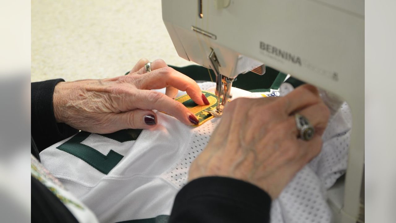 Captains patches are sewn to Packers jerseys