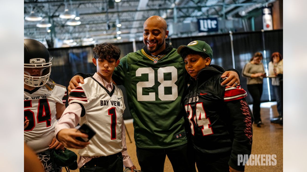 Photos: Packers surprise high school football teams with new helmets