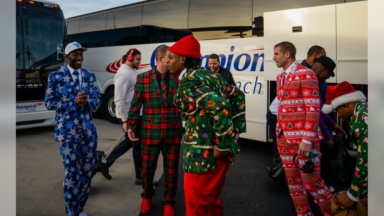 Packers wear Christmas suits to North Carolina