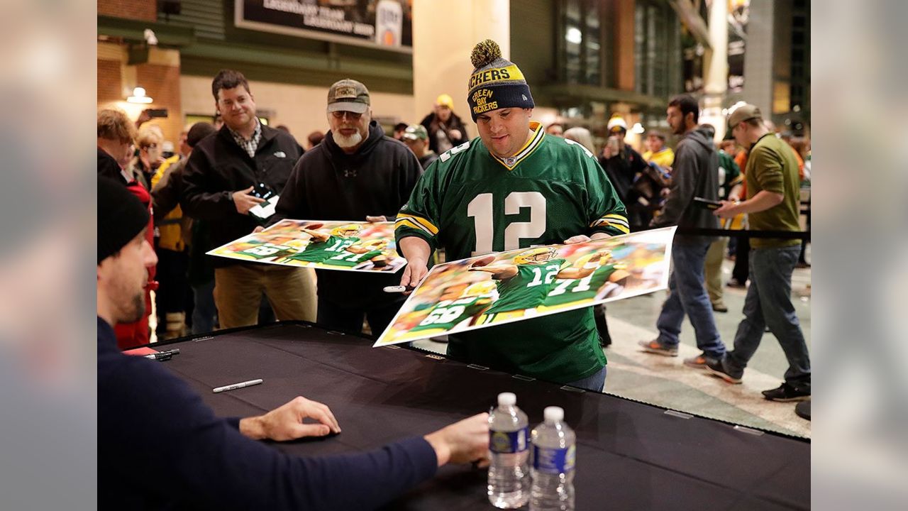 Aaron Rodgers signing autographs for - Green Bay Packers