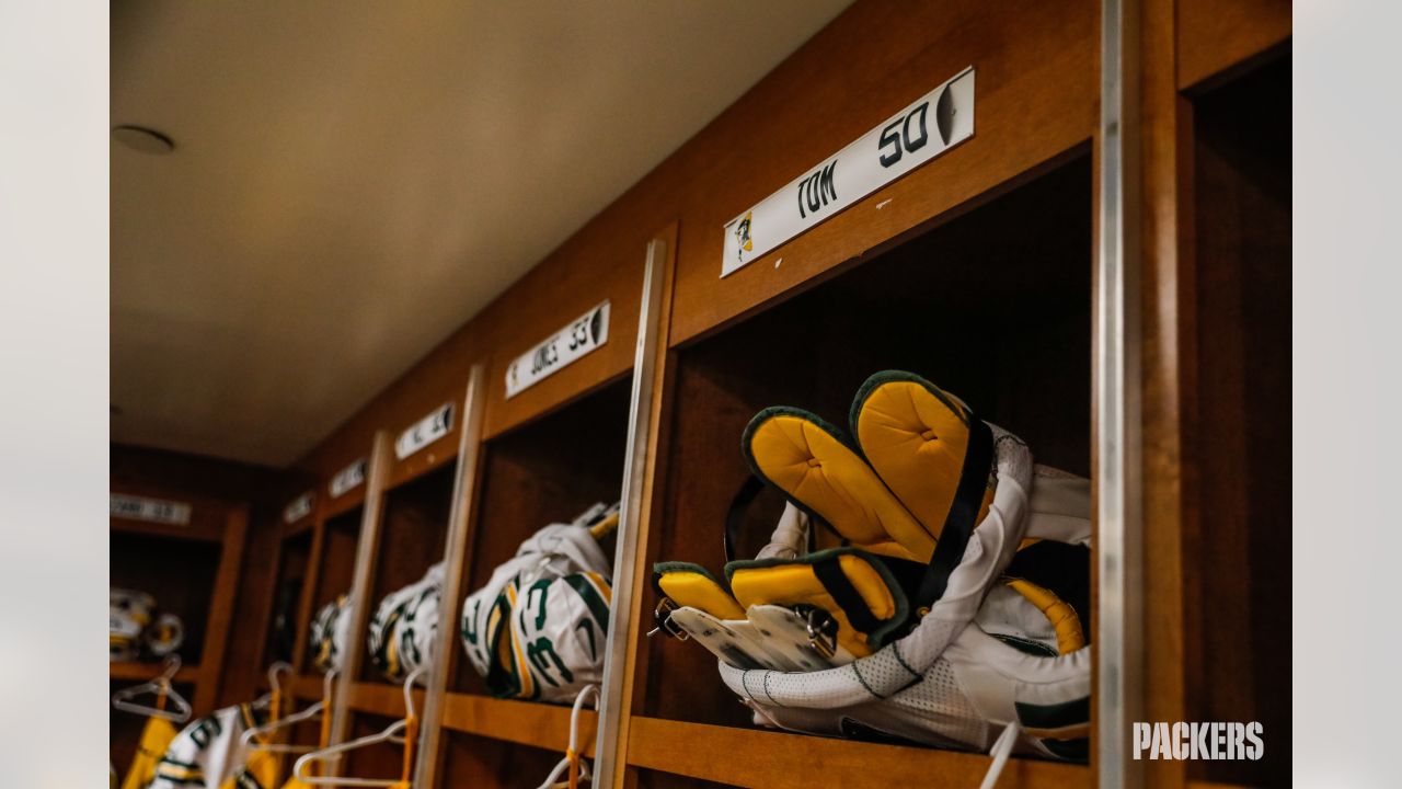 Details in Detroit: Packers' equipment staff prepares uniforms for