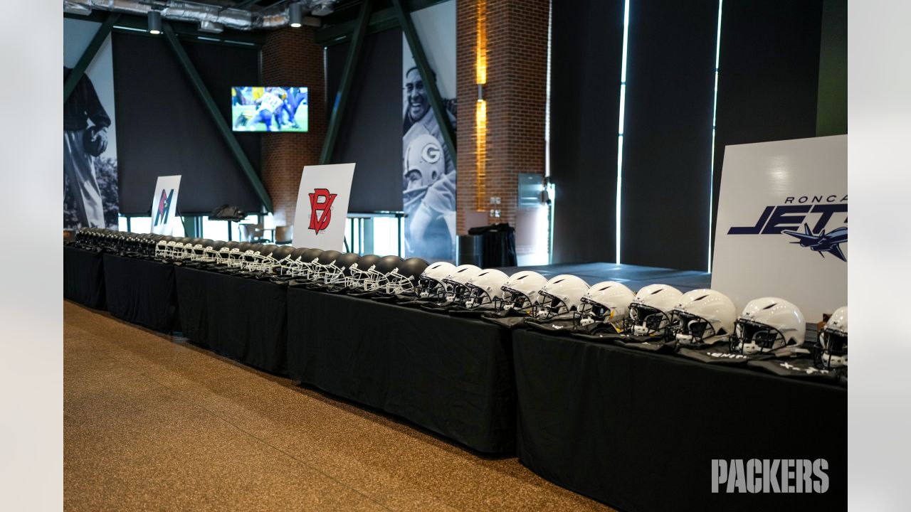 Photos: Packers surprise high school football teams with new helmets