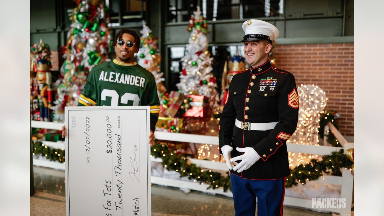 Photos: Packers, Jaire Alexander award donations to Toys for Tots at  Lambeau Field