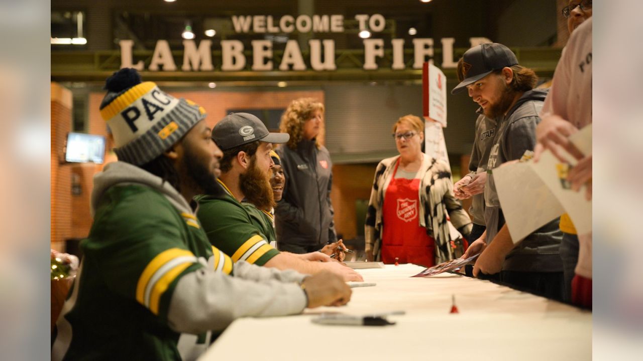 Packers players sign autographs at final Salvation Army signing session of  year