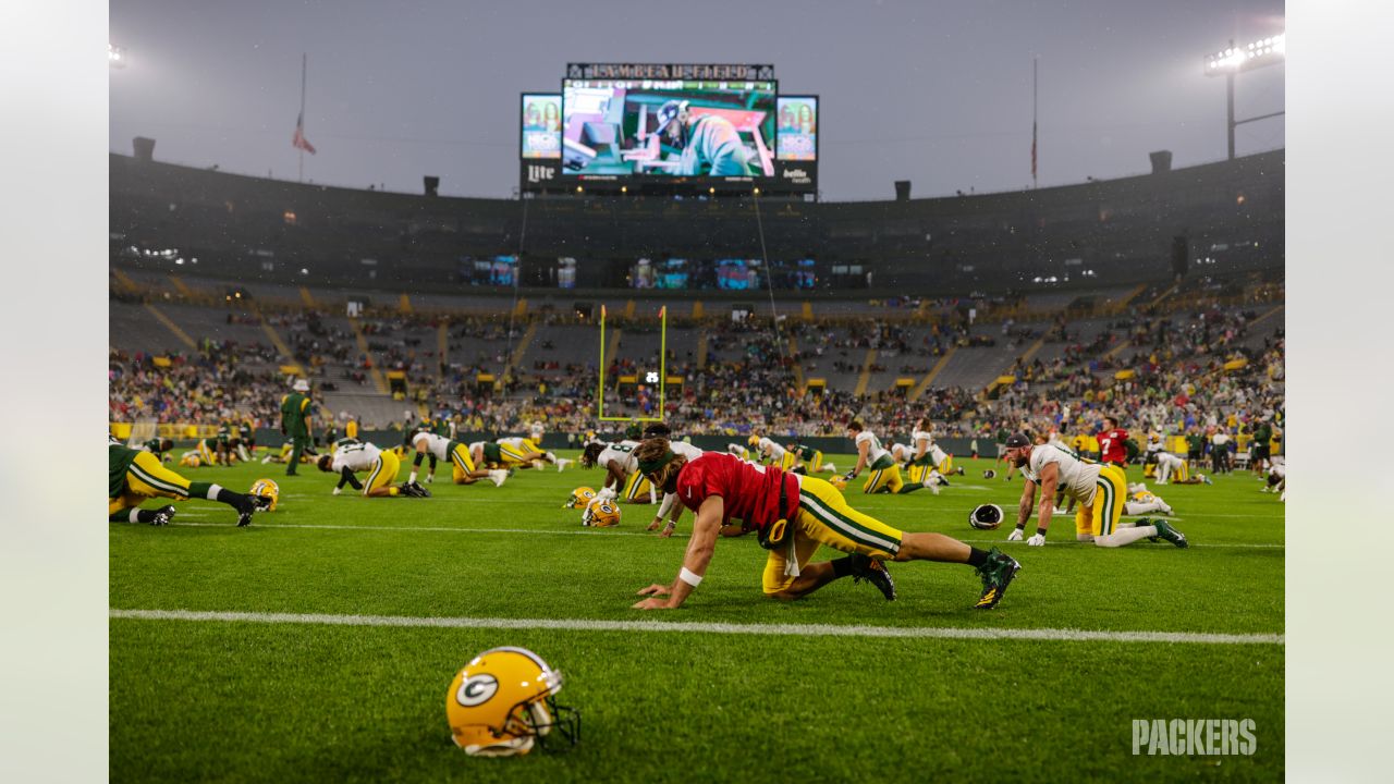 Fans wait out rain to see historic match at Lambeau