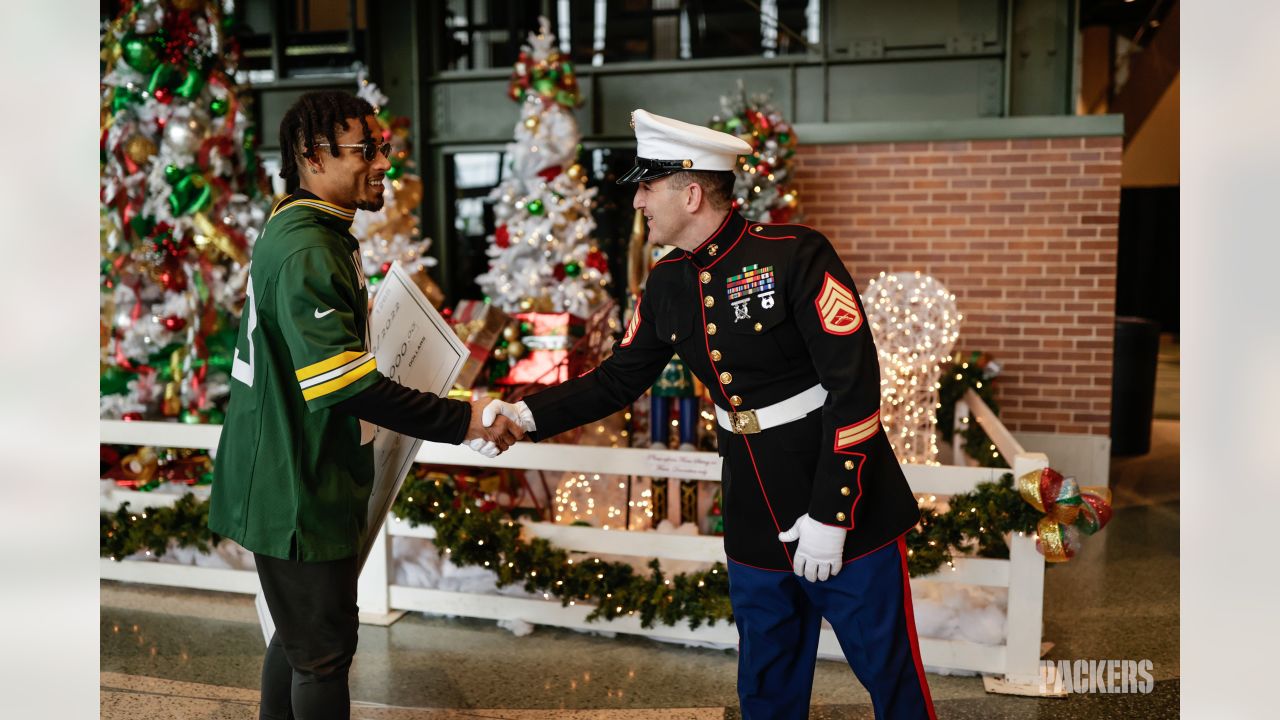 Photos: Packers, Jaire Alexander award donations to Toys for Tots at  Lambeau Field