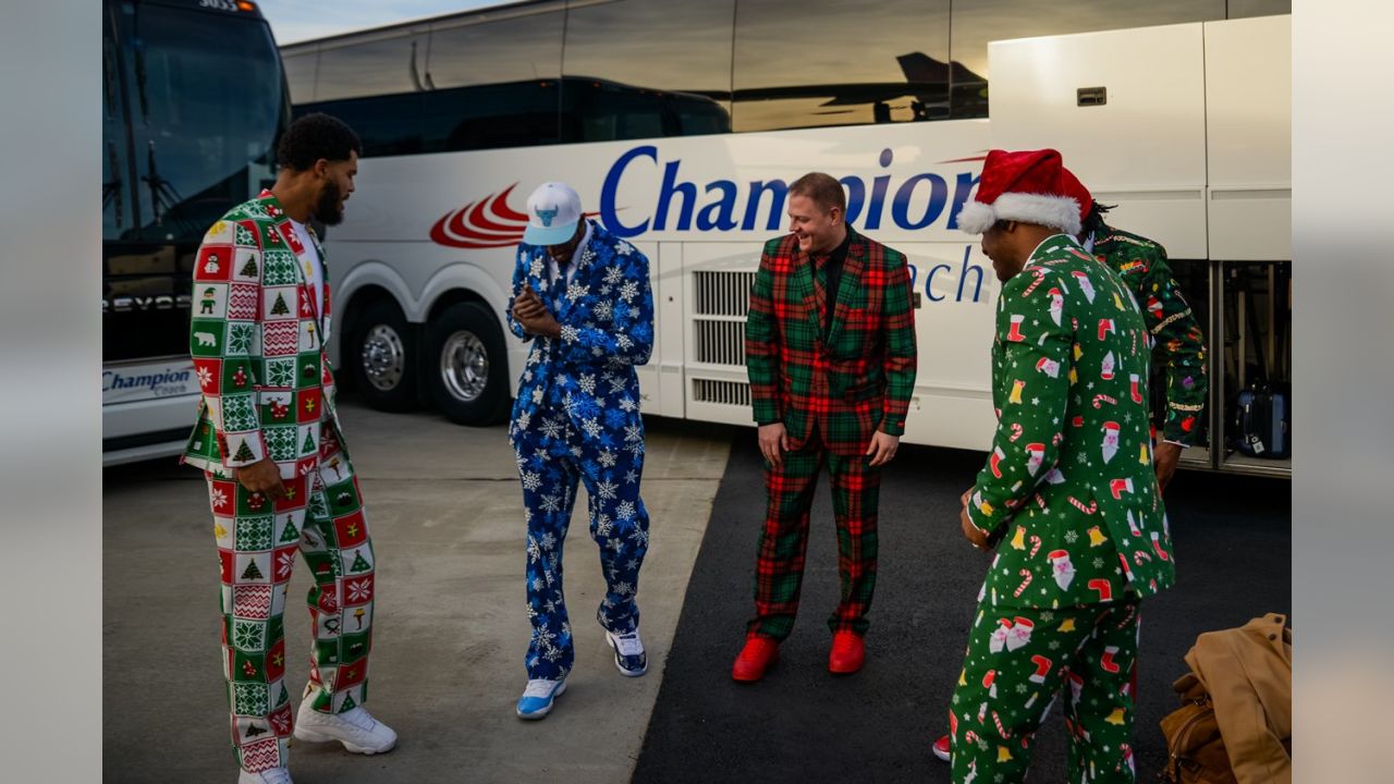 Packers wear Christmas suits to North Carolina