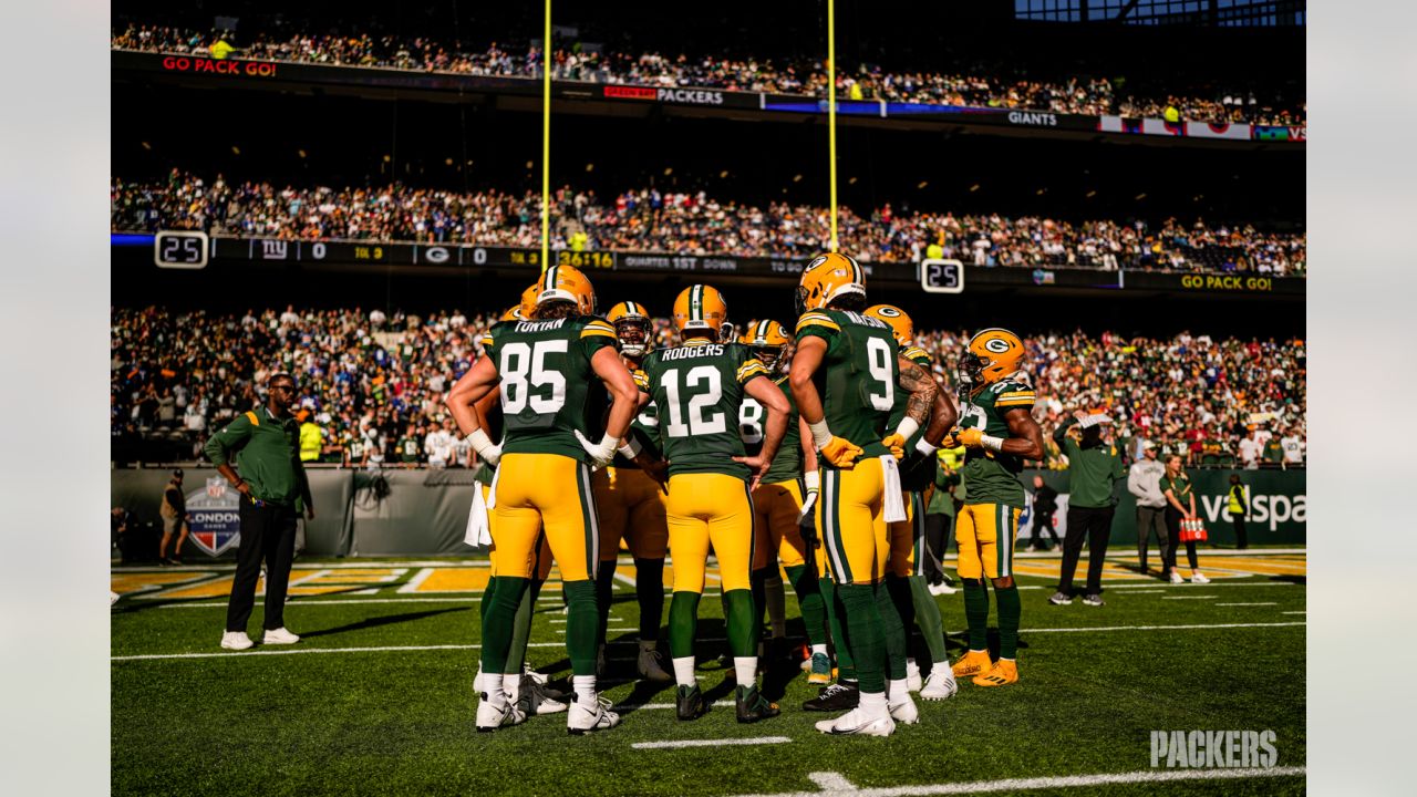 Green Bay Packers players form a huddle as they warm-up before an NFL game  between the New York Giants and the Green Bay Packers at the Tottenham  Hotspur stadium in London, Sunday