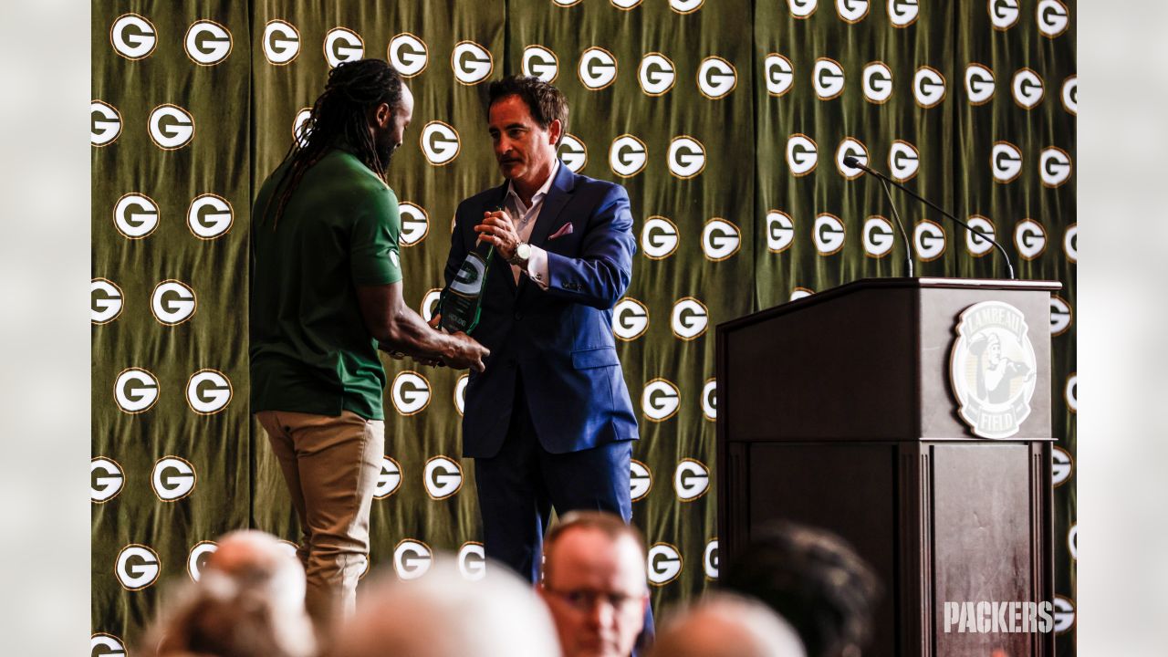 Aaron Rodgers sports Canadian tuxedo at Welcome Back Packers Luncheon