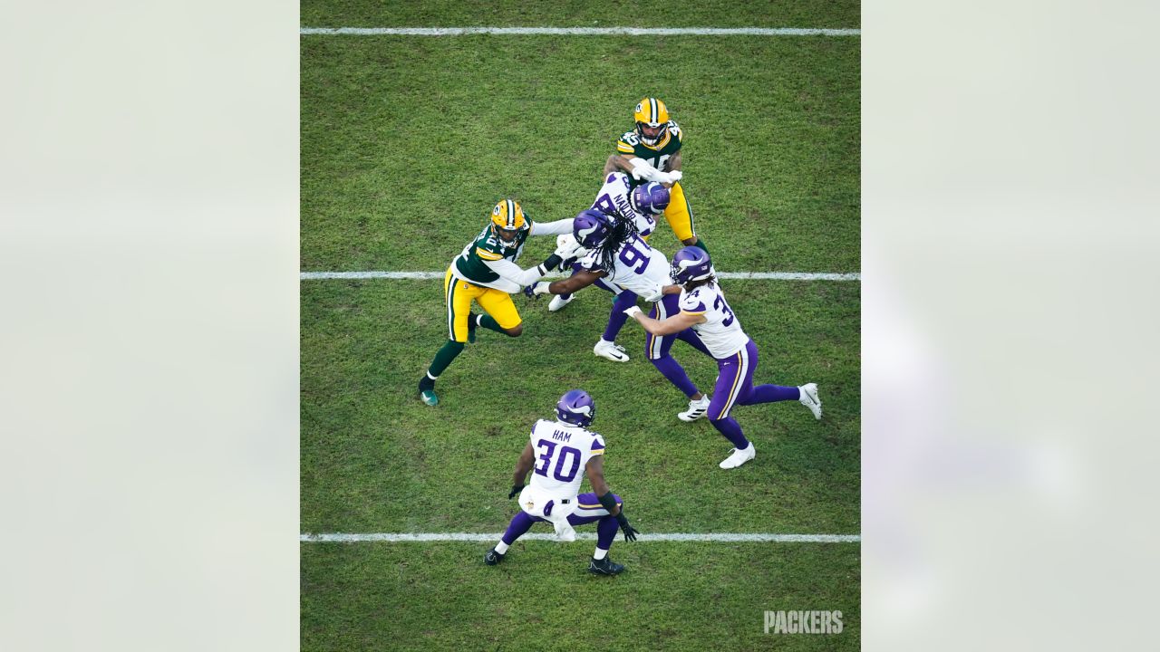 Chicago Bears vs. Minnesota Vikings. NFL Game. American Football League  match. Silhouette of professional player celebrate touch down. Screen in  background. Stock Photo