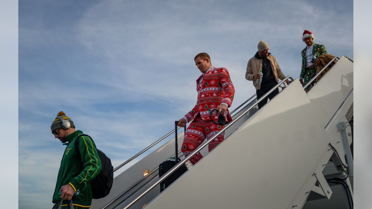 Packers wear Christmas suits to North Carolina