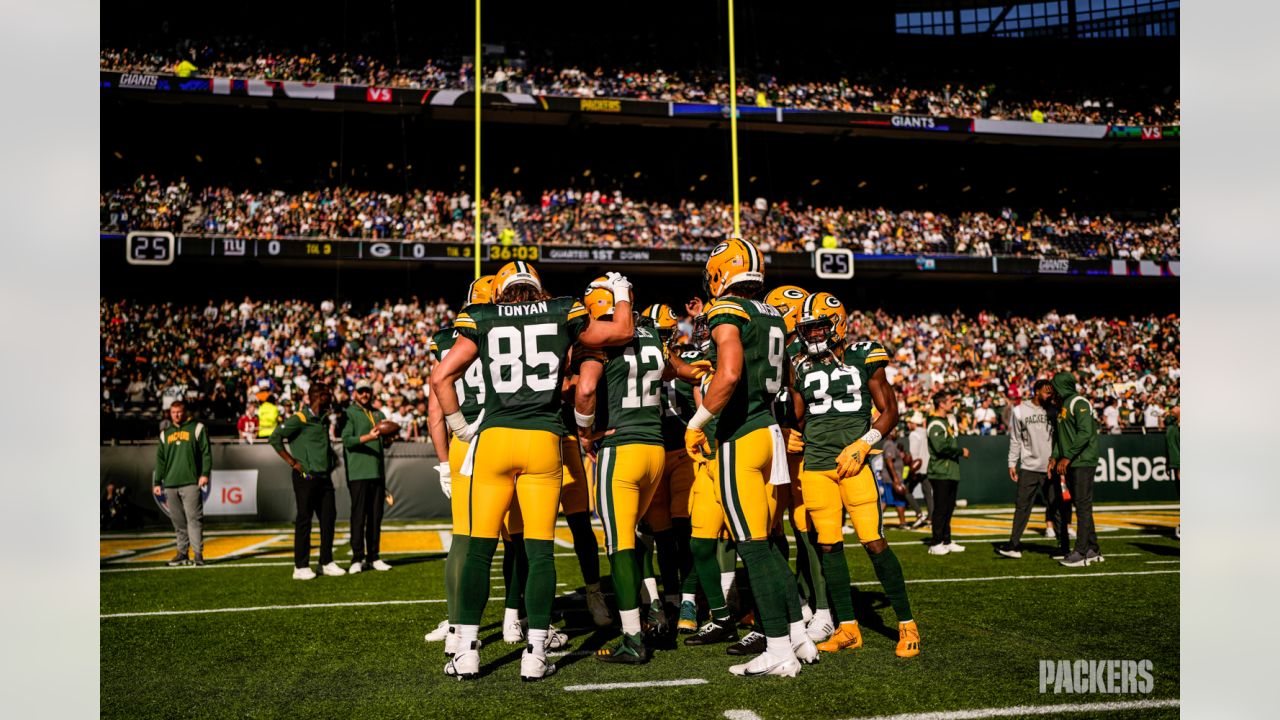 Green Bay Packers players form a huddle as they warm-up before an NFL game  between the New York Giants and the Green Bay Packers at the Tottenham  Hotspur stadium in London, Sunday