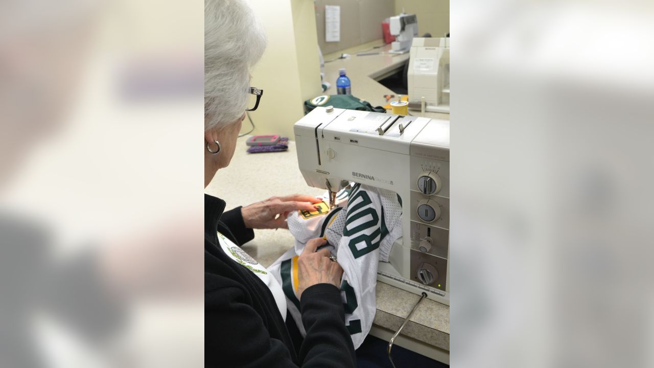 Captains patches are sewn to Packers jerseys