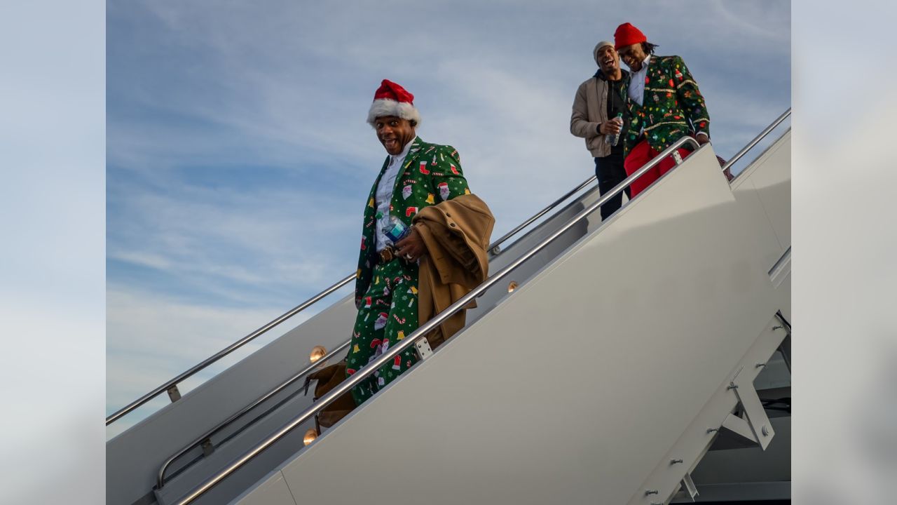 Packers wear Christmas suits to North Carolina