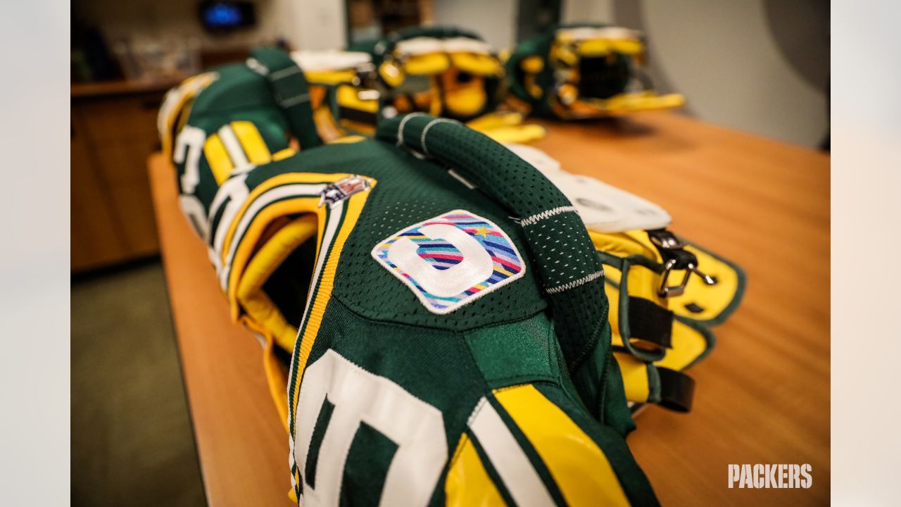 Finishing touches: Equipment staff preps Packers' uniforms for