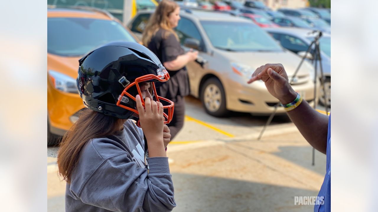 Packers Give Back donates new helmets to four high school football