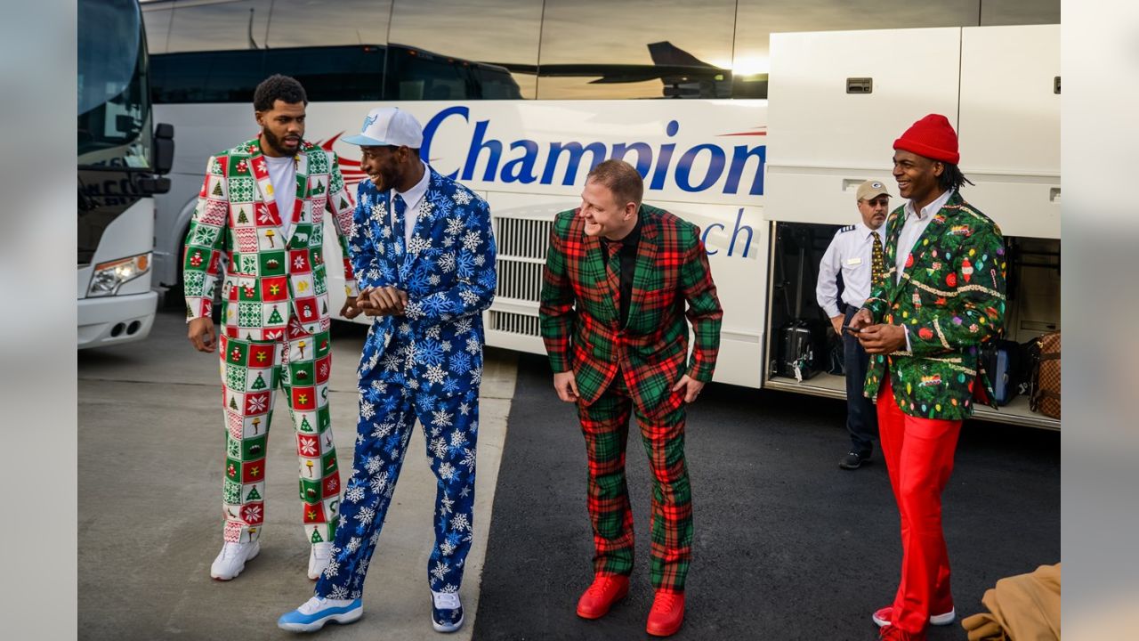 Packers wear Christmas suits to North Carolina