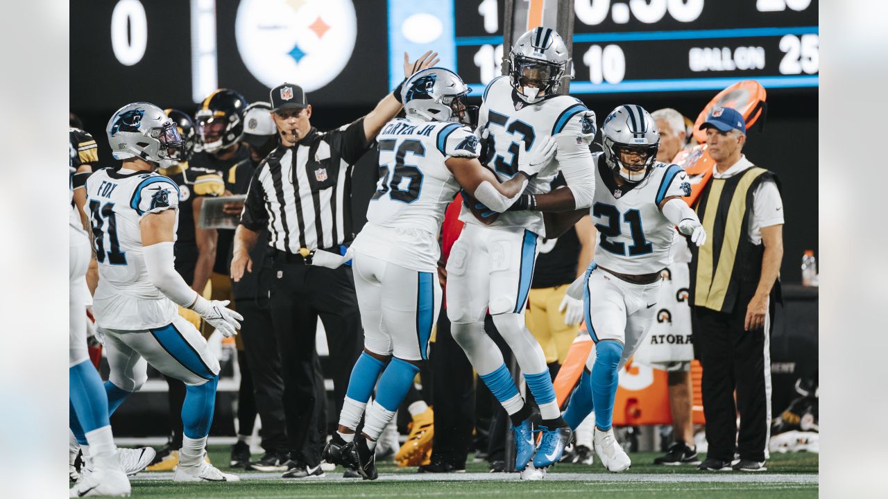 Carolina Panthers kicker Ryan Santoso wears a 9/11 FDNY hat during