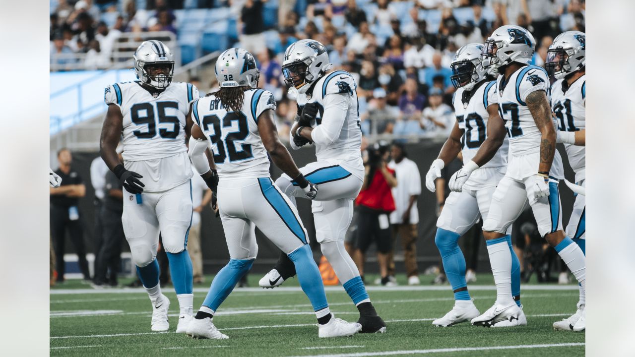 Carolina Panthers linebacker Frankie Luvu runs a drill during