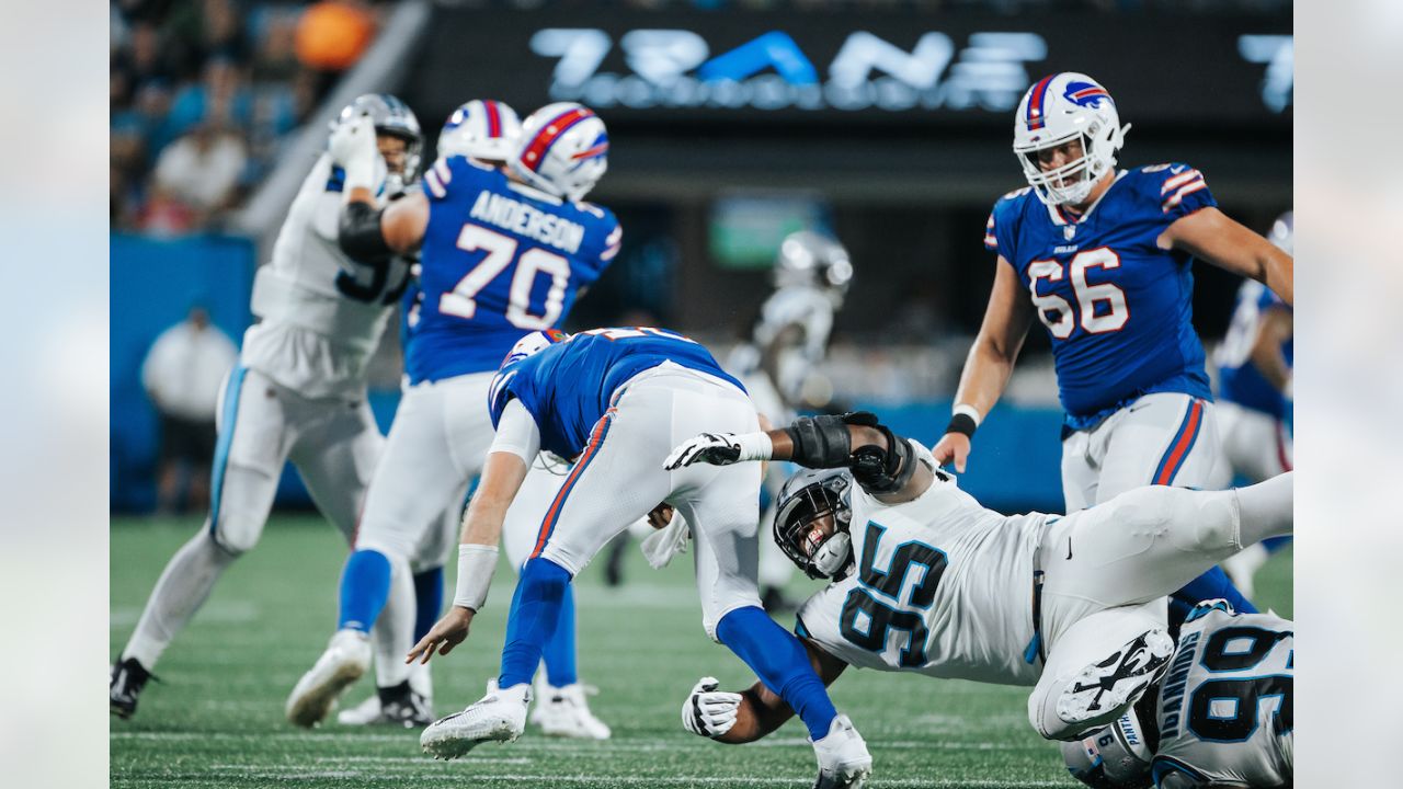 Buffalo Bills running back Duke Johnson (22) attempts to avoid the tackle  by Carolina Panthers cornerback Kalon Barnes (35) during an NFL preseason  football game on Friday, Aug. 26, 2022, in Charlotte