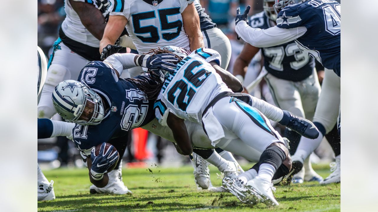 Carolina Panther running back Anthony Johnson (23), runs the ball as Dallas  Cowboy's Shante Carver (96), and Panther Howard Griffith (30) look on  during the third quarter of te NFC Divisional Playoff