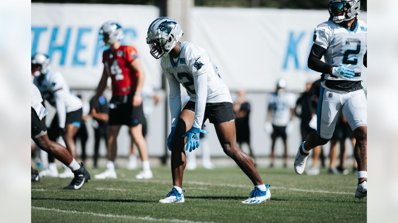 Carolina Panthers guard Michael Jordan stands on the field at the