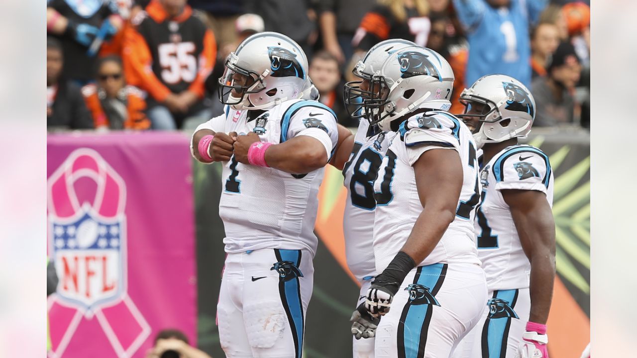 Carolina Panthers quarterback Cam Newton (1) calls a play in the huddle  during the first half of an NFL football game against the Los Angeles Rams  in Charlotte, N.C., Sunday, Sept. 8