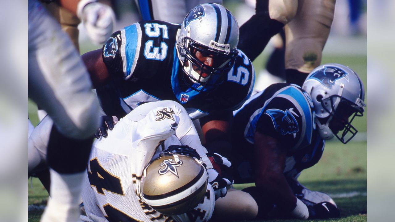 Carolina Panthers kicker John Kasay (4) and holder Ken Walter (13)  celebrate Kasay's 61-yard field goal on the final play of the game to  defeat the New England Patriots 23-20 at Ericsson