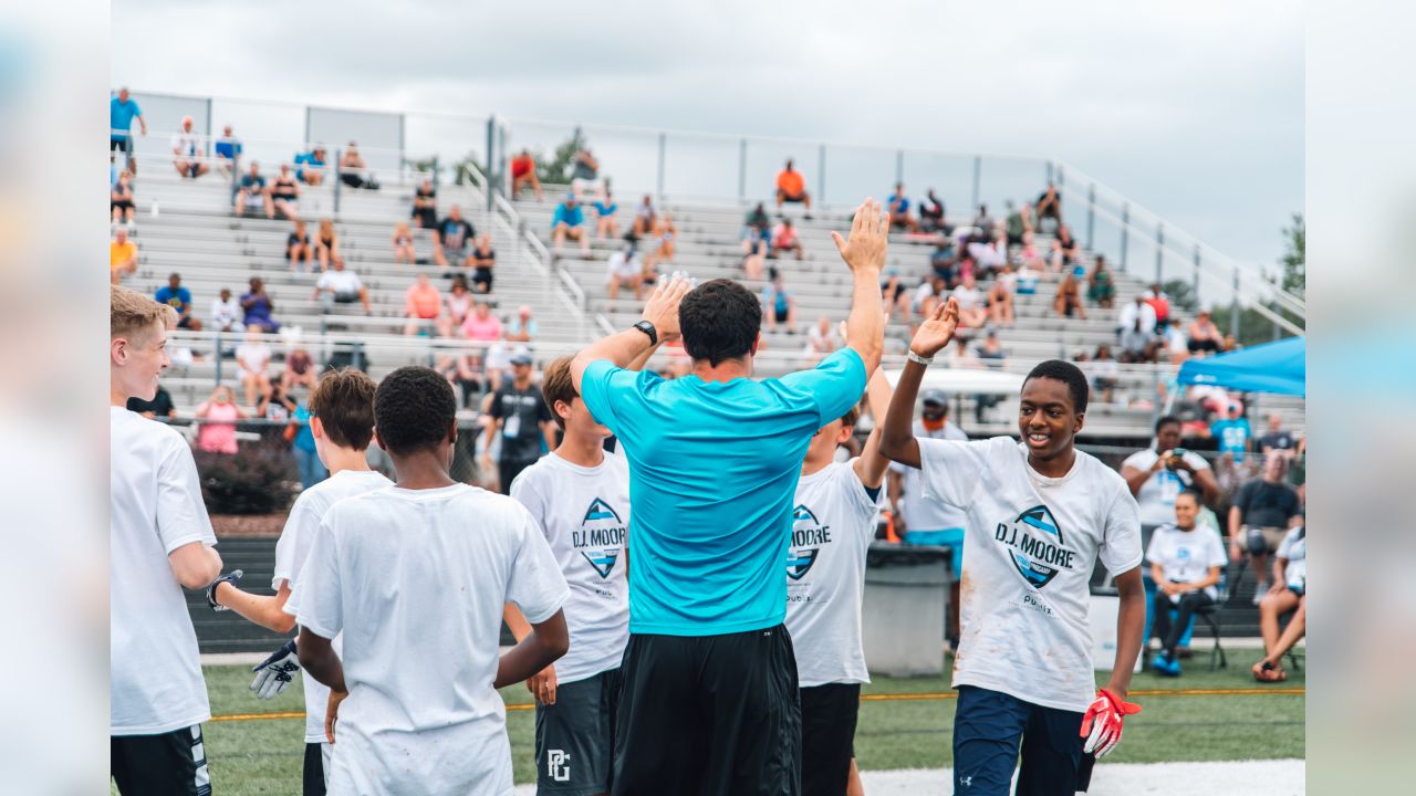 Luke Kuechly helps out at DJ Moore's youth football camp