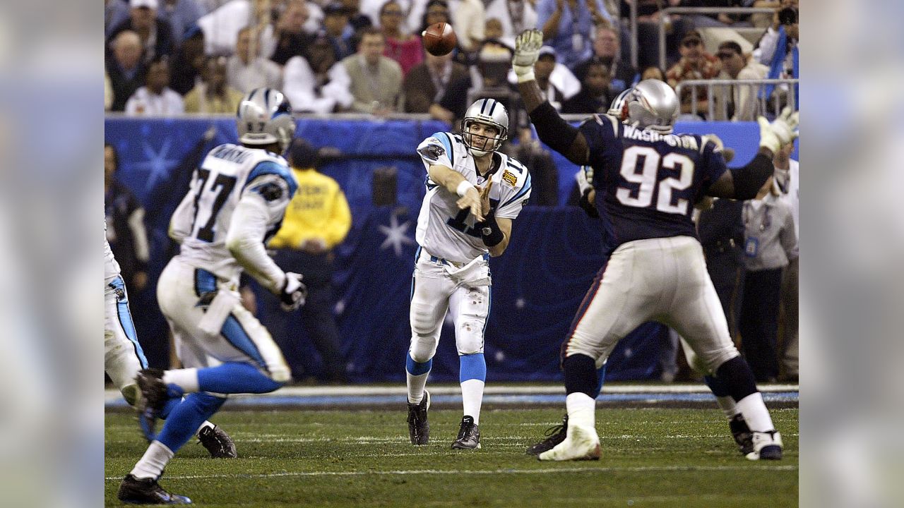 01 Feb 2004: Jake Delhomme of the Carolina Panthers fights off a tackler  during the New England Patriots 32-29 win over the Carolina Panthers in  Super Bowl XXXVIII at Reliant Stadium in