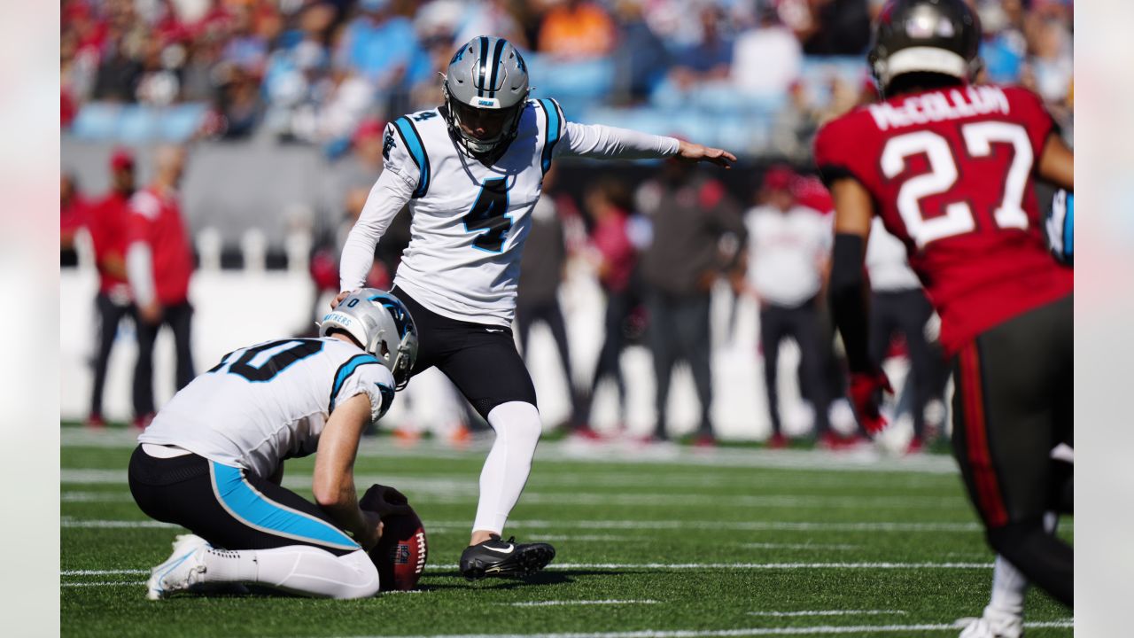 Tampa Bay Buccaneers vs. Carolina Panthers. NFL Game. American Football  League match. Silhouette of professional player celebrate touch down.  Screen in background. Stock Photo