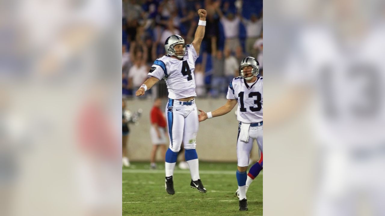 Carolina Panthers kicker John Kasay (4) and holder Ken Walter (13)  celebrate Kasay's 61-yard field goal on the final play of the game to  defeat the New England Patriots 23-20 at Ericsson