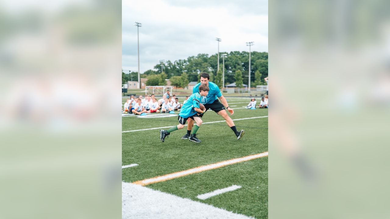 Luke Kuechly helps out at DJ Moore's youth football camp