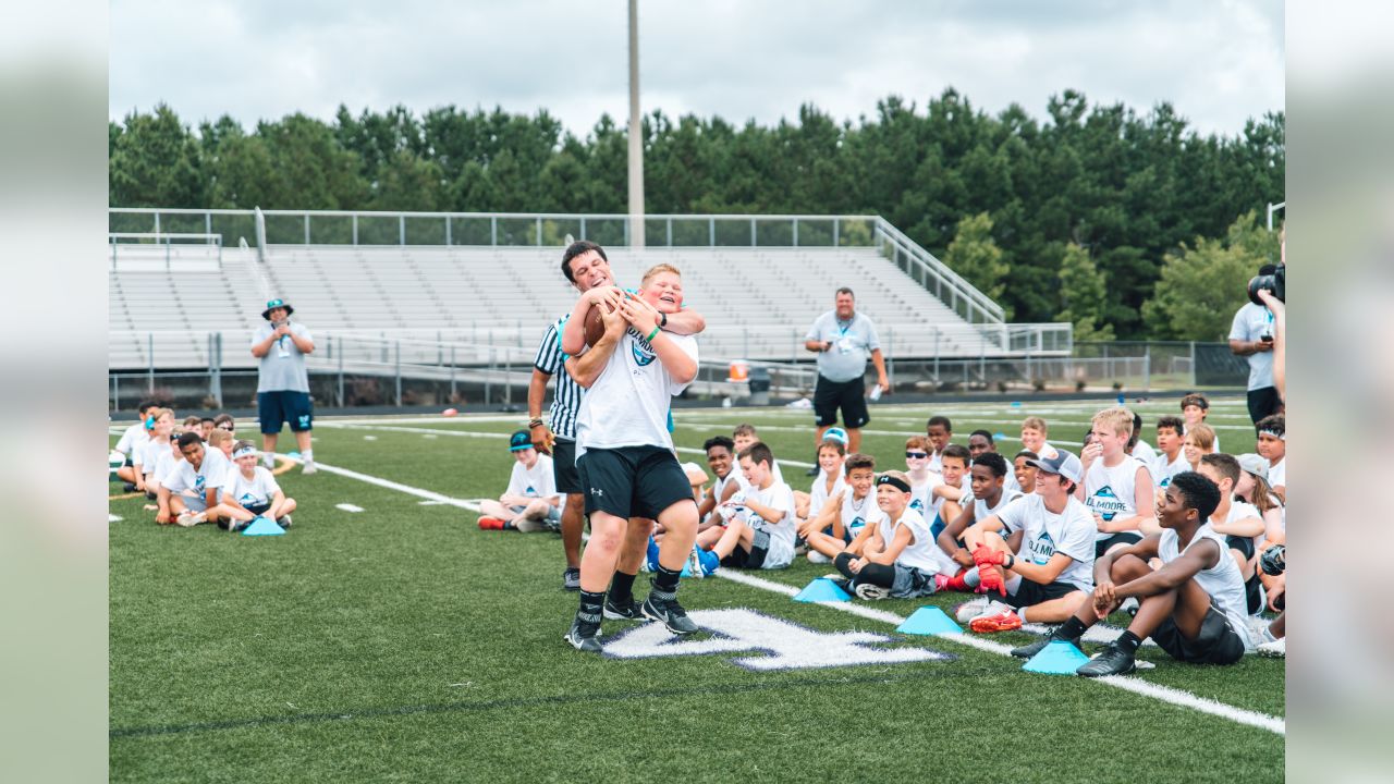 Luke Kuechly helps out at DJ Moore's youth football camp