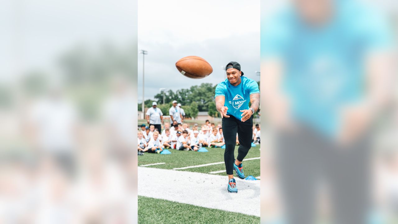 Luke Kuechly helps out at DJ Moore's youth football camp