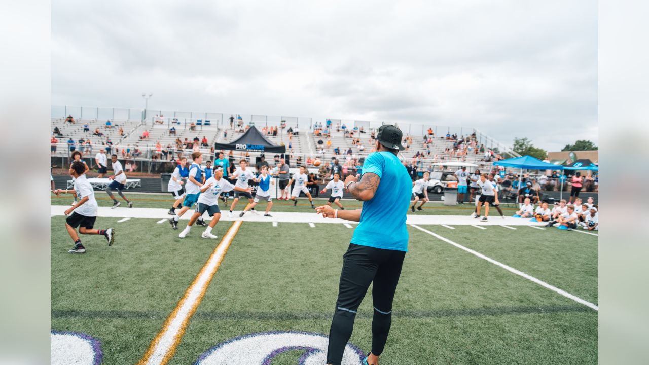 Luke Kuechly helps out at DJ Moore's youth football camp