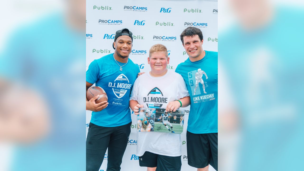 Luke Kuechly helps out at DJ Moore's youth football camp