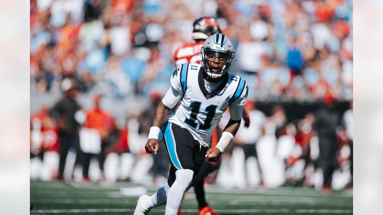 Tampa Bay Buccaneers vs. Carolina Panthers. NFL Game. American Football  League match. Silhouette of professional player celebrate touch down.  Screen in background. Stock Photo