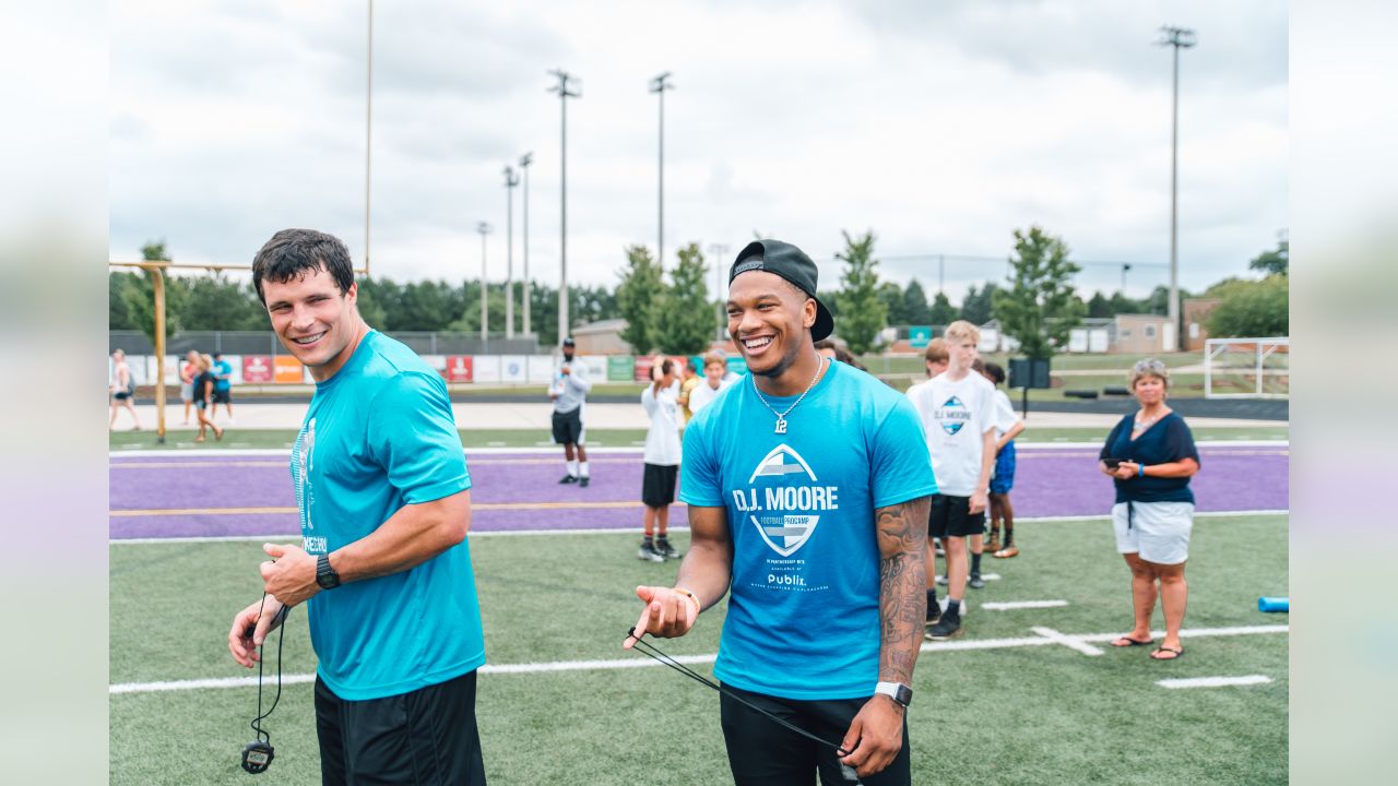 Luke Kuechly helps out at DJ Moore's youth football camp