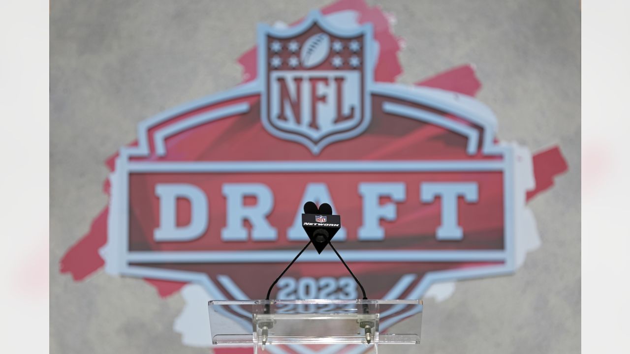 Colleen Wolfe, left, Charles Davis, center, and Daniel Jeremiah pose for a  photograph before Daniel Jeremiah's Mock Draft at the NFLN set at the NFL  Draft on Wednesday, April 26, 2023 in