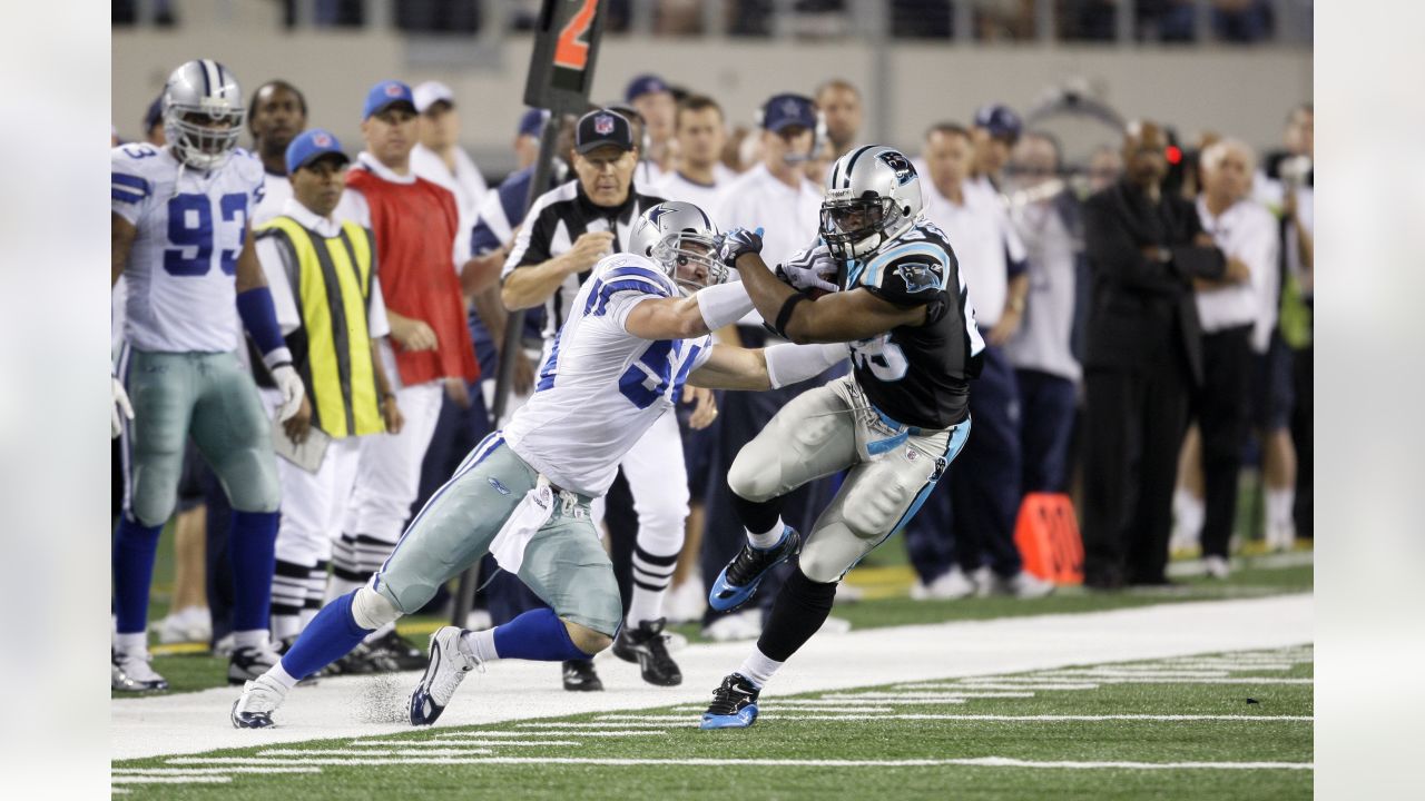 Carolina Panther running back Anthony Johnson (23), runs the ball as Dallas  Cowboy's Shante Carver (96), and Panther Howard Griffith (30) look on  during the third quarter of te NFC Divisional Playoff