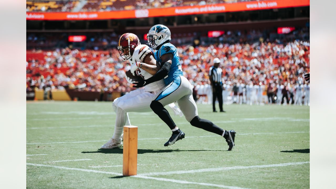 Buffalo Bills running back Duke Johnson (22) attempts to avoid the tackle  by Carolina Panthers cornerback Kalon Barnes (35) during an NFL preseason  football game on Friday, Aug. 26, 2022, in Charlotte